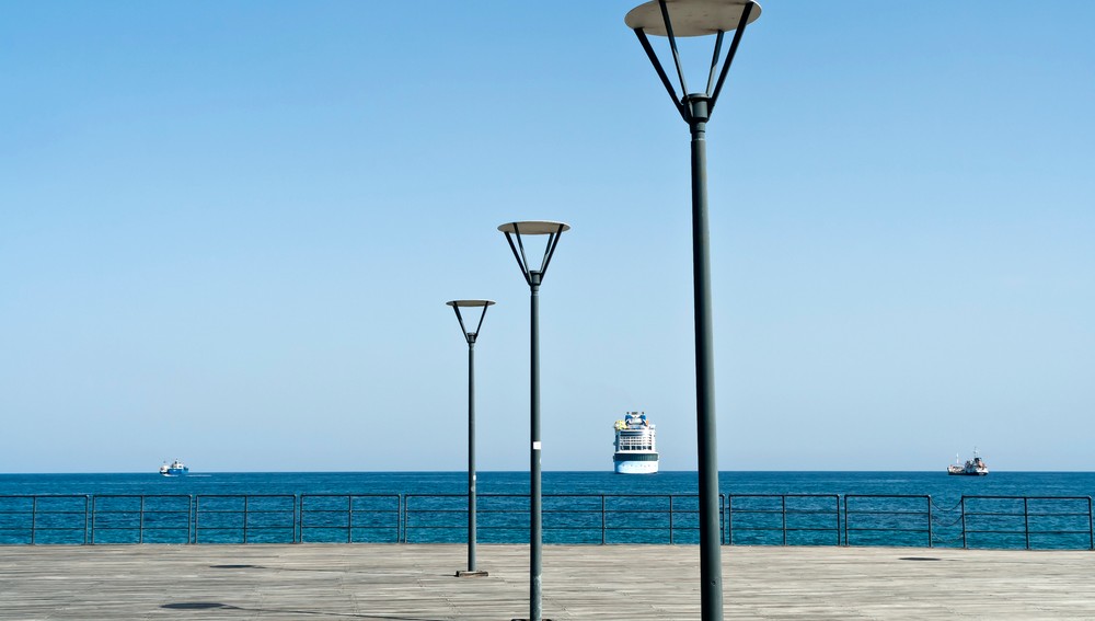 Empty,Wooden,Sea,Pier,With,Three,Street,Lamps,In,Front