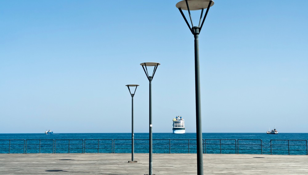 Empty,Wooden,Sea,Pier,With,Three,Street,Lamps,In,Front